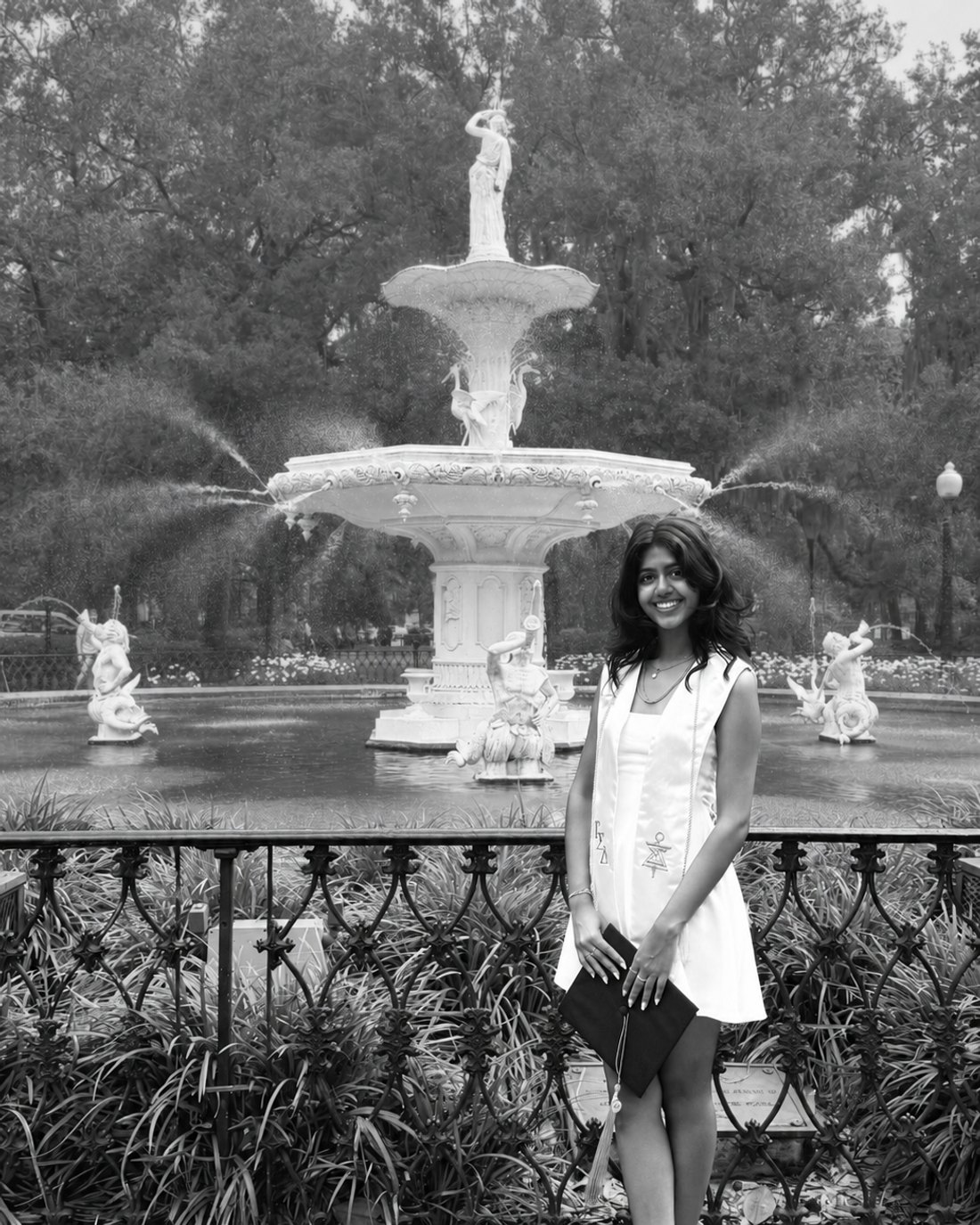 Khushi Patel at the Forsyth Park fountain in Savannah, in graduation dress